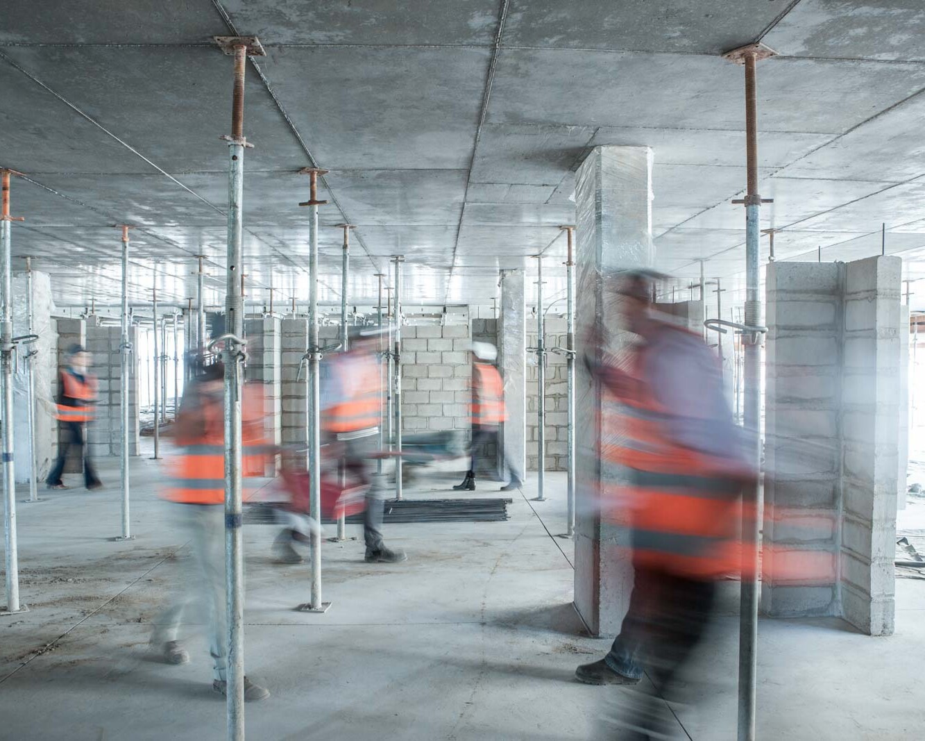 six blurred construction workers on the go in busy 2024 plescia cd