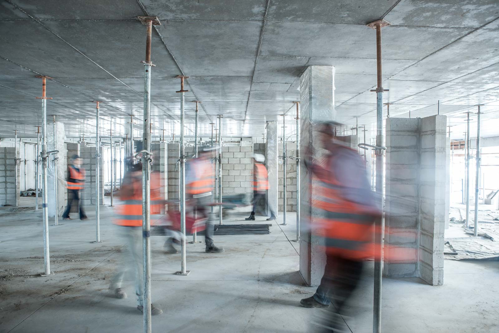 six blurred construction workers on the go in busy 2024 plescia cd