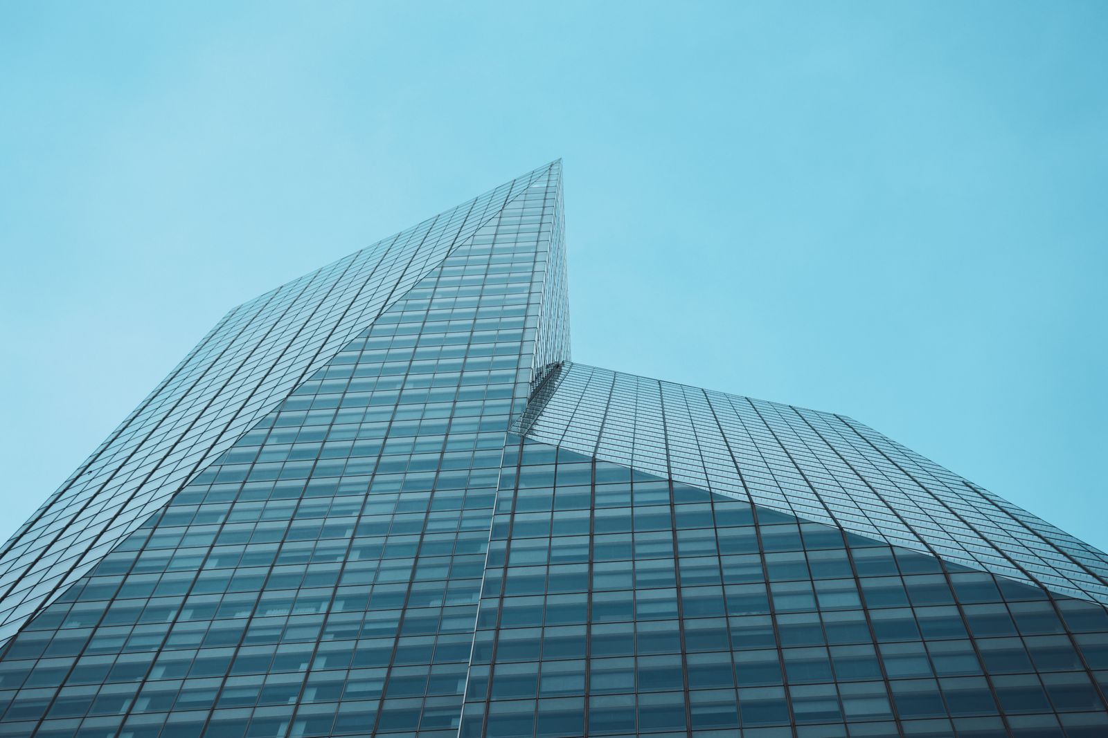 Glass curtain-wall facade of a Midtown Manhattan commercial office tower