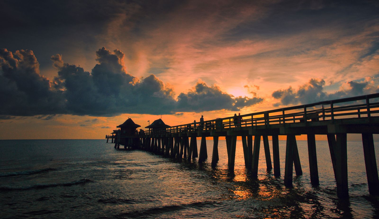 A Gulf-coast dock at dawn, representative of Naples