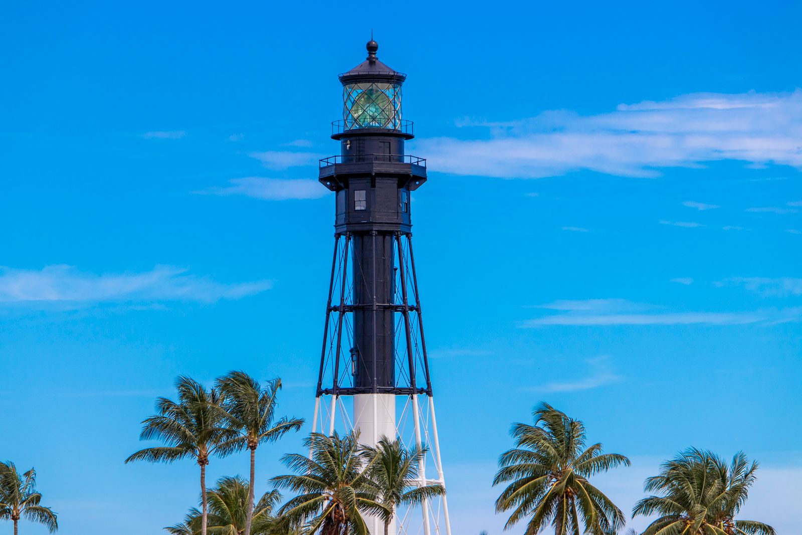 A lighthouse and palms near Pompano Beach