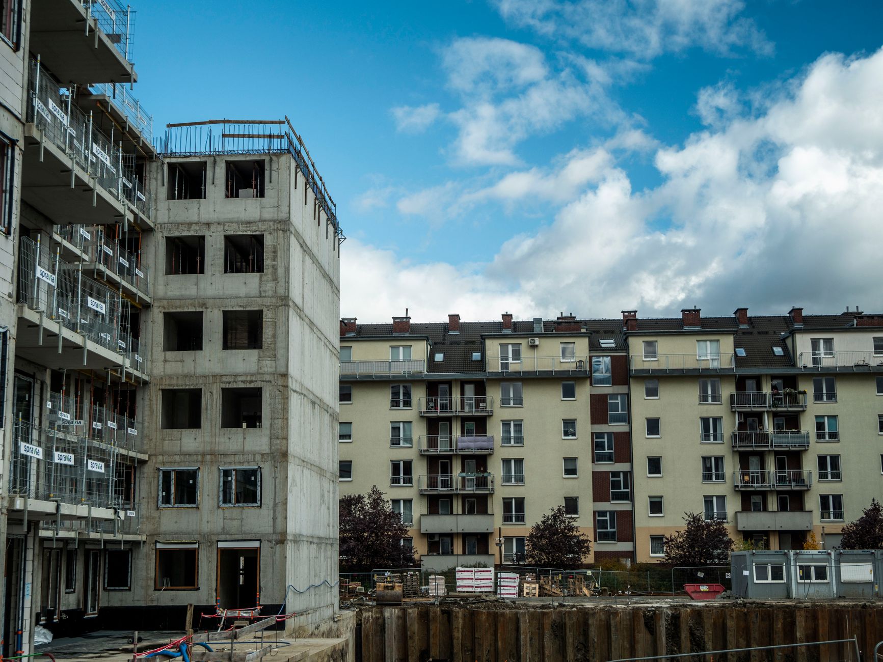 Urban building construction, representative of build-outs across Astoria