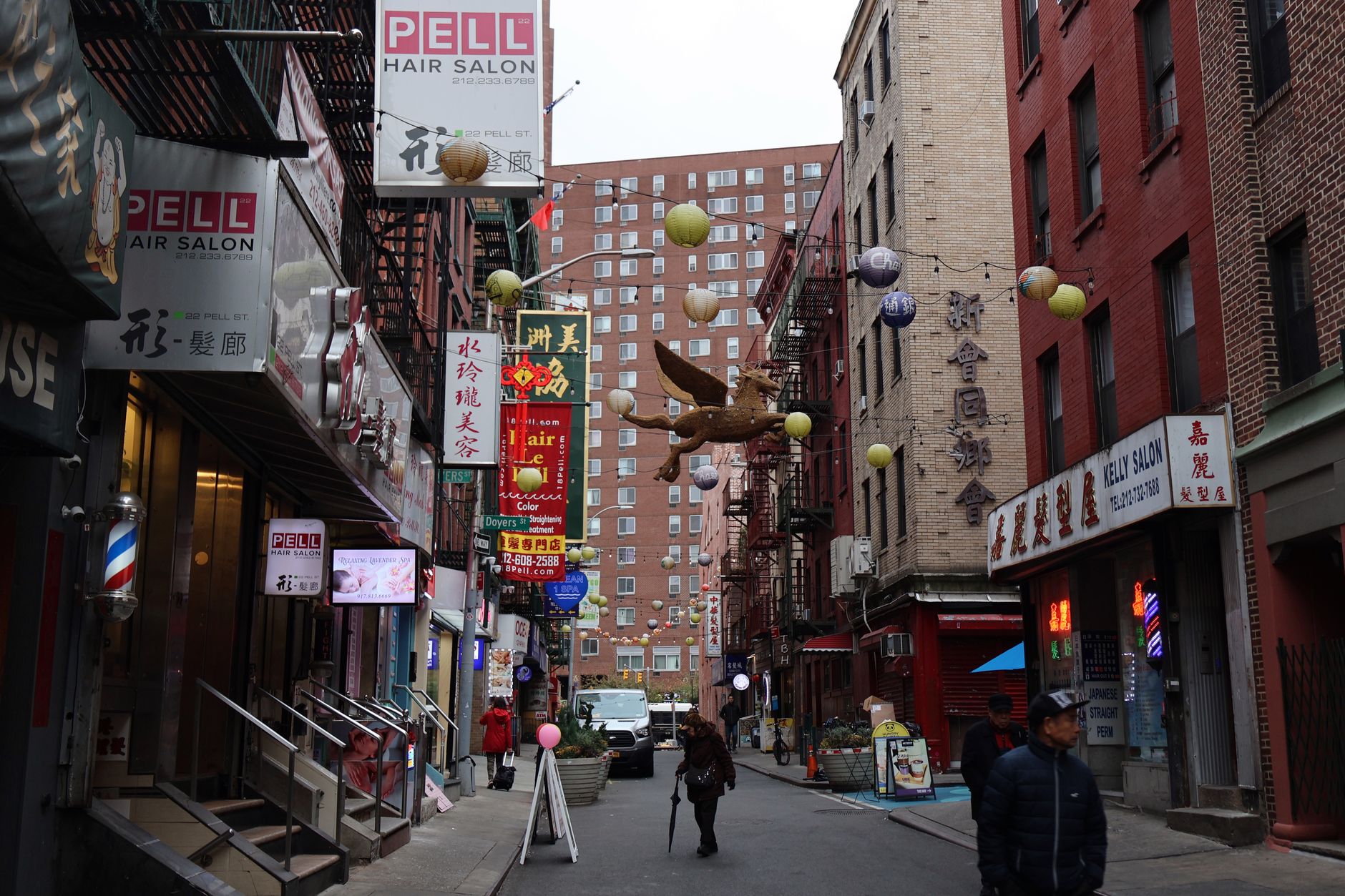 Dense commercial street, representative of Astoria's Steinway Street and 30th Avenue corridors