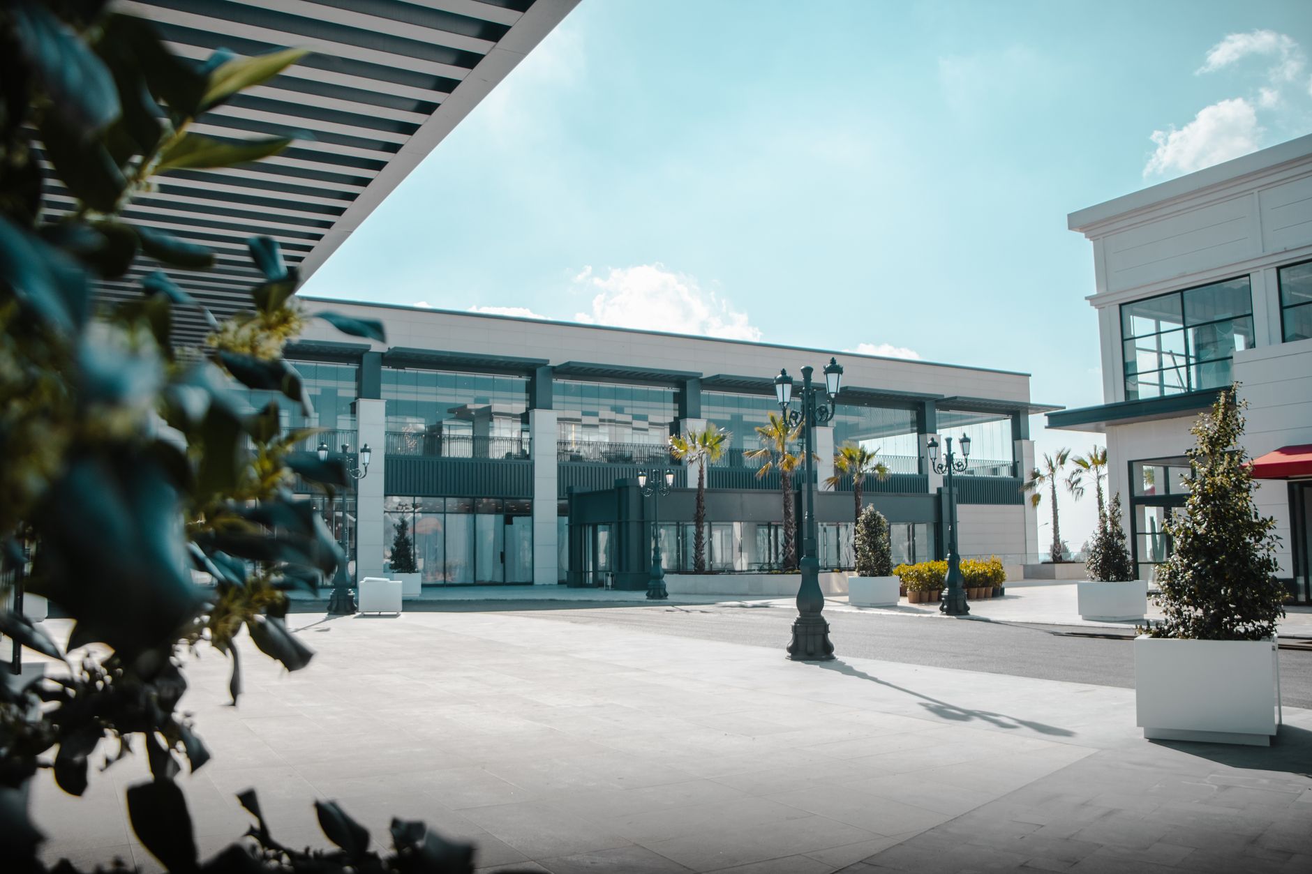 Palm-lined shopping plaza, representative of Kendall's Kendall Drive retail corridor